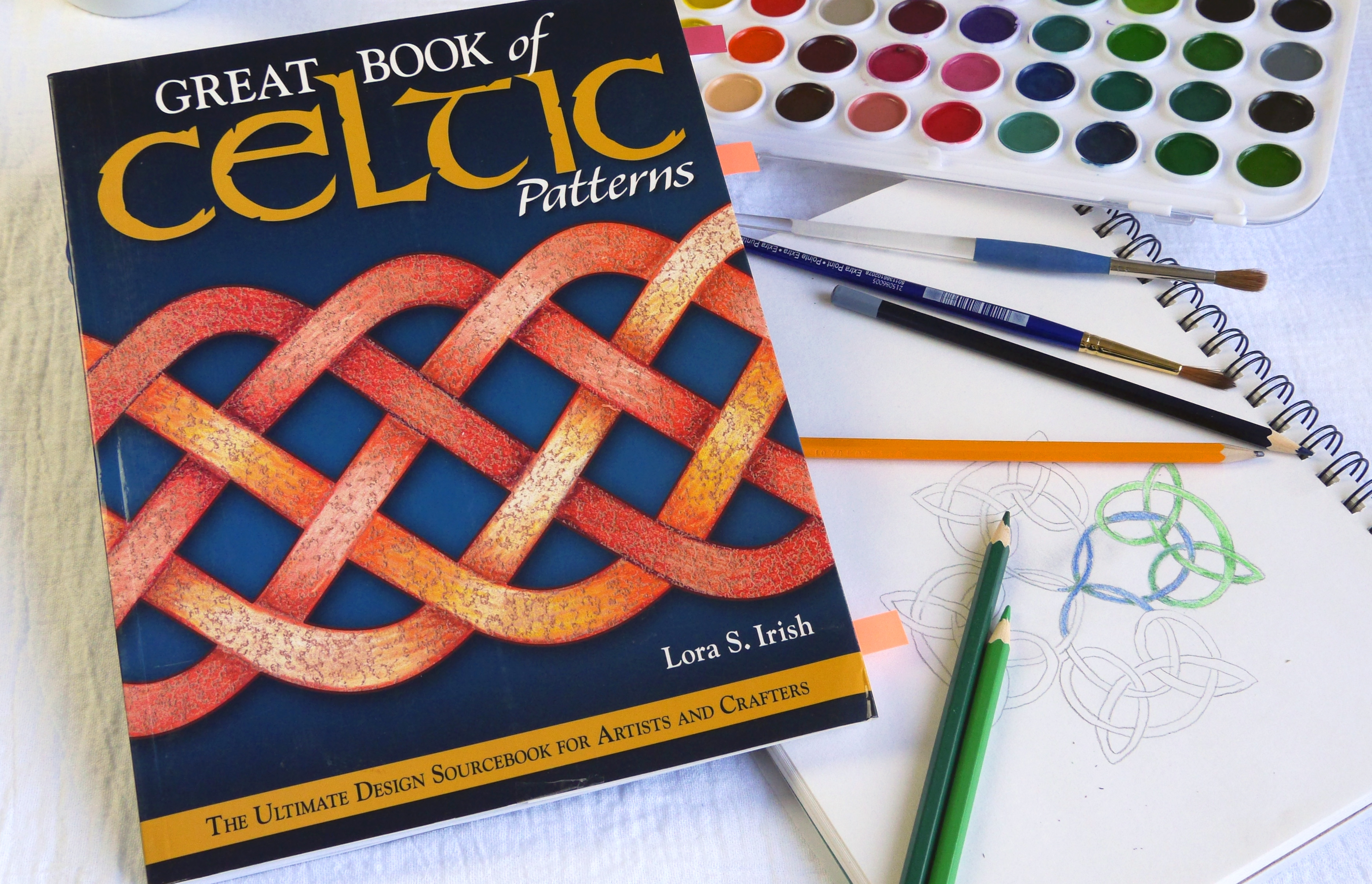 Great Book of Celtic Patterns book with a celtic knot drawing and watercolors.