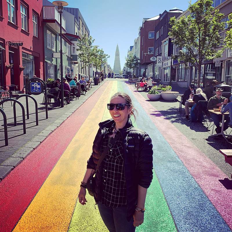 Blythe standing on the Rainbow Walk in Reykjavik, Iceland